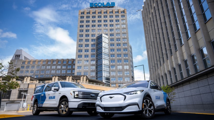 Ecolab vehicles, Ford brand, parked on a street with the Ecolab building in the background.